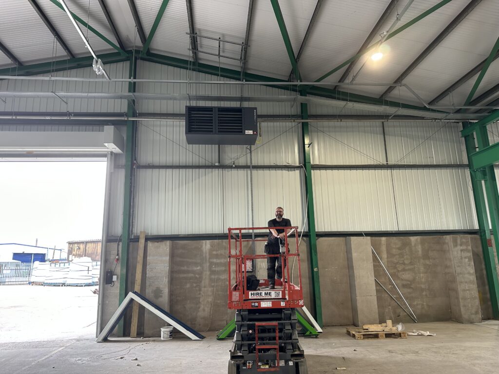 Our engineer installing warm air system